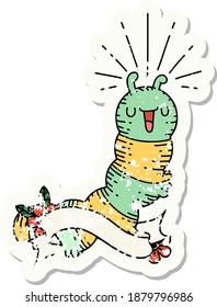 worn old sticker of a tattoo style happy caterpillar