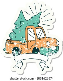 worn old sticker of a tattoo style truck carrying trees