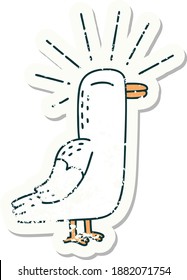 worn old sticker of a tattoo style seagull bird