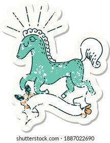 worn old sticker of a tattoo style prancing stallion