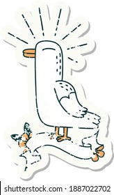 worn old sticker of a tattoo style seagull bird