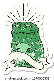 worn old sticker of a tattoo style toad character