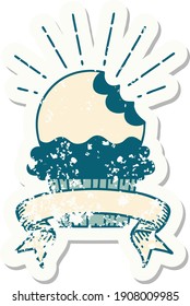 worn old sticker of a tattoo style cupcake with missing bite