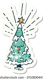 worn old sticker of a tattoo style happy christmas tree