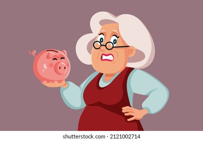 
Worried Elderly Woman Holding a Piggy bank Vector Cartoon Illustration. Senior lady having no more money saved for pension retirement plan
