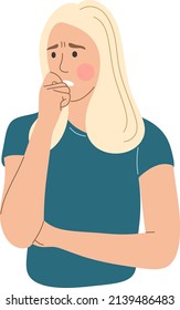 A worried woman bites her nails.