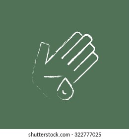 Wounded palm hand drawn in chalk on a blackboard vector white icon isolated on a green background.