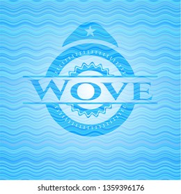 Wove sky blue water wave style badge.