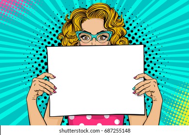 Wow female face. Sexy young blonde woman with wide open eyes in glasses holding blank board for your offer. Vector colorful background in pop art retro comic style. Party invitation poster.
