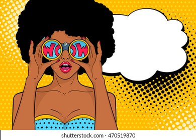 Wow pop art face. Sexy surprised african woman with open mouth holding binoculars with inscription wow in reflection and speech bubble. Vector colorful background in pop art retro comic style.