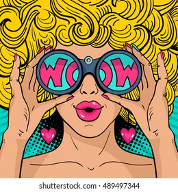 Wow pop art face. Sexy surprised woman with blonde curly hair and open mouth holding binoculars in her hands with inscription wow in reflection.Vector colorful background in pop art retro comic style.