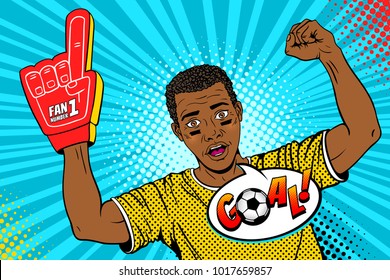 Wow pop art face. Young happy afro football fan with open mouth rising his hand celebrates win and Goal speech bubble. Vector colorful illustration in retro comic style. Sport game invitation poster.