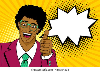 Wow pop art man. Happy young surprised african man in glasses and suit shows thumb up with open mouth, afro hairstyle and speech bubble. Vector cartoon background in pop art retro comic style. 