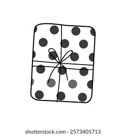 Wrapped gift with black and white polka dots on a simple pattern background