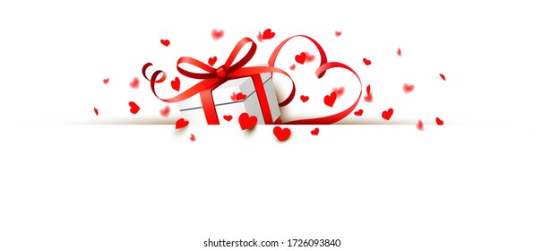 Wrapped giftbox with heartshaped ribbon and red heart confetti partially hidden behind a banner.