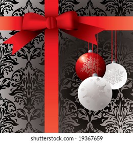 Wrapped present with baulbels and a wallpaper patern