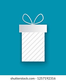 Wrapped Xmas present cut out icon, isolated on blue. Vector package box, stripes decorations, surprise on Christmas and New Year, topped by bow