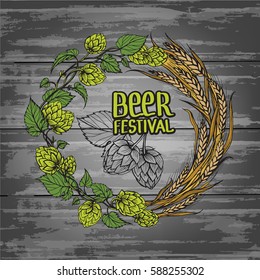 a wreath of ears of wheat and hops on old blackboard