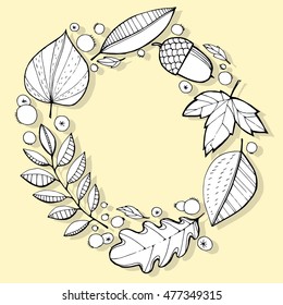 The wreath of fallen leaves. The leaves of trees. Autumn leaves. Circle of leaves. The leaves and berries. Line art. Drawing by hand. Graphic arts. Doodle.