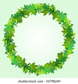 Wreath made of summer green maple and oak leaves