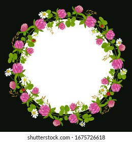 A wreath of pink clover and daisies. Round frame with field herbs.