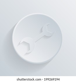 wrench. circle white paper icon with a long shadow.