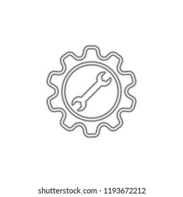 wrench in gear. Dotted outline silhouette with shadow on white background