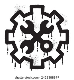 Wrench graffiti on gear wheel drawn with black spray paint