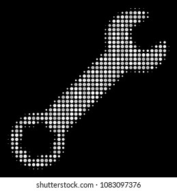 Wrench halftone vector icon. Illustration style is pixelated iconic wrench symbol on a black background. Halftone pattern is created from spheric items.