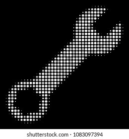 Wrench halftone vector icon. Illustration style is pixelated iconic wrench symbol on a black background. Halftone pattern is build from circle elements.