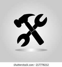 Wrench and hammer. Tools icon isolated on gray background