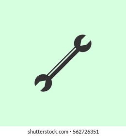 Wrench icon flat. Grey vector symbol on green background