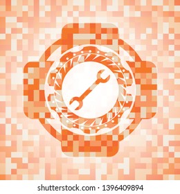 wrench icon inside abstract orange mosaic emblem
