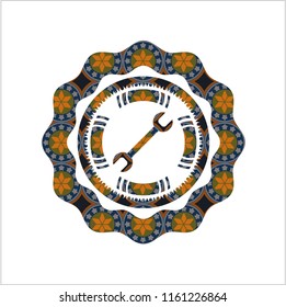 wrench icon inside arabic badge background. Arabesque decoration.