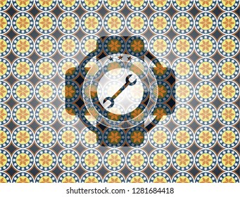 wrench icon inside arabic style emblem. Arabesque decoration.