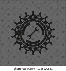 wrench icon inside black emblem