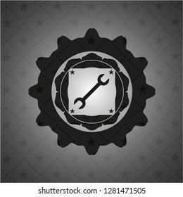 wrench icon inside black emblem