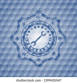 wrench icon inside blue badge with geometric pattern background.