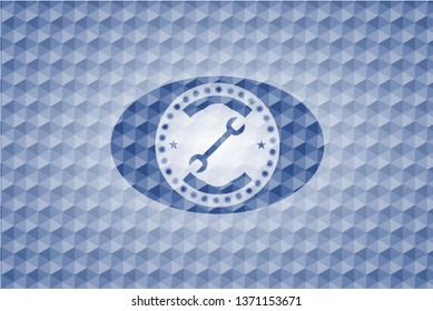 wrench icon inside blue polygonal badge.