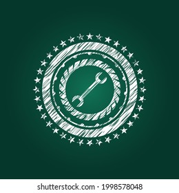 icono de la llave dentro del emblema de la tiza. 