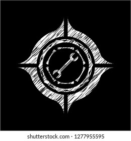 wrench icon inside chalkboard emblem on black board