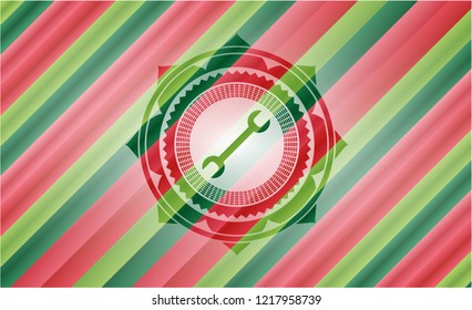 wrench icon inside christmas badge background.