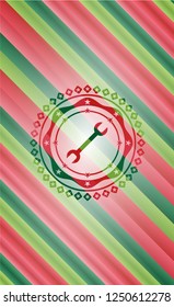 wrench icon inside christmas colors style badge.