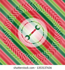 wrench icon inside christmas colors style emblem.