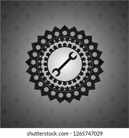 wrench icon inside dark badge