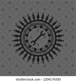 wrench icon inside dark emblem