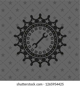 wrench icon inside dark emblem
