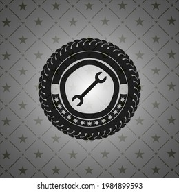 icono de la llave dentro del emblema oscuro. 