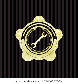 Icono de llave dentro del emblema de oro o placa