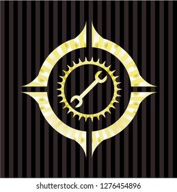 wrench icon inside gold shiny badge